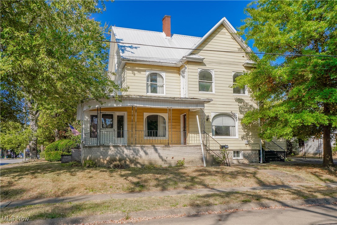 Don’t miss this incredible opportunity to own a spacious colonial in the heart of Orrville! Full of character, it begins with a wraparound porch that includes an enclosed sun porch, perfect for relaxing or dropping coats and shoes before heading inside. Beautiful original woodwork and hardwood floors greet you in the parlor, which connects to the living room featuring an arched bay window. French doors open to the dining room with a cozy corner fireplace and direct sight lines into the well-planned kitchen with abundant cabinetry and a center island. A full bath on the main floor doubles as a convenient first-floor laundry with a double-sink vanity.
Upstairs, you’ll find four comfortable bedrooms, including one with a bonus space that could serve as a walk-in closet, playroom, or home office. The shared full bath blends modern and vintage touches with its jetted tub and pedestal sink.
Outside, enjoy the covered parking provided by the carport, a shed for tools and toys, and a desirable corner lot close to schools, parks, shopping, and dining. Call today to see it for yourself!