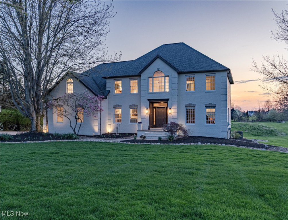 A Nature Enthusiast’s Dream in Granger Township and Highland Schools! Nestled on nearly 2.5 acres near the end of a peaceful cul-de-sac and renovated by design firm Gem and Clay, this estate offers a rare mix of luxury, modern comfort, and natural beauty. The home’s curb appeal is enhanced by extensive landscaping, custom brick entry columns, and a freshly painted exterior. Inside, sunlight fills a beautifully updated interior featuring white oak hardwood floors throughout. The open-concept main level includes a grand family room with soaring ceilings and a cozy fireplace, a formal dining room, a stylish living room, a designer half bath, and a home office with custom built-ins. The chef’s kitchen is equipped with premium appliances, quartz counters and backsplash, and a large island. The kitchen opens to a 1,000 sq ft Trex deck with integrated lighting, gas lines for a grill and firepit, and views of a private 1/3-acre lake with a 30-foot waterfall and 40-foot beach. Upstairs, the luxurious primary suite features two walk-in closets, in-suite laundry, and a spa-style bath with dual vanities, a soaking tub, and a glass-enclosed tile shower. Three additional bedrooms and a fully updated second bath complete the upper level. The finished walk-out lower level adds approximately 1,500 sq ft of living space. Including a soundproofed bedroom, full bath, home theater, bar/lounge. Walk-out access and windows throughout provide natural light. Outside, enjoy a 1,000 sq ft covered patio and a hot tub, perfect for year-round relaxation. Major updates include a Lennox HVAC system, iron filter, water softener, and reverse osmosis system, along with upgraded well and septic components. Improvements feature smart switches, ceiling fans, light fixtures, built-in appliances, and a full Crestron Home Automation system that controls AV, HVAC, lighting, and security. Conveniently located minutes from I-271, I-71, and I-77, this private retreat is truly a rare find!