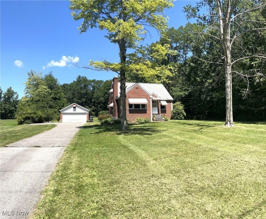 Discover the perfect blend of comfort and potential with this breathtaking 1-acre property! This three-bedroom brick cape boasts updated replacement windows and a newer roof on both the house and the garage. Enjoy the spacious kitchen with ample counter space and a generous dinette area, ideal for entertaining! The first-floor master bedroom and the living room both feature hardwood floors, with the living room also offering a cozy fireplace. A large storage barn provides extra space, and the full basement is ready for your finishing touches. With a large driveway offering additional parking and a convenient turnaround, this property is both practical and inviting. Bring your decorative flair to make this house your dream home! Don’t miss out on this unique opportunity!