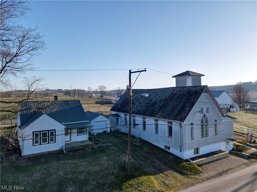 Open House Tuesday April 18th, 2023 from 4:00-6:00 PM. Auction Date: Tuesday, May 2nd, 2023 starting at 5:00 PM 
Located in the Garaway School District, this property includes both a residential home and a historic church building. The home, built in 1950, features 3-4 bedrooms, a kitchen, and a living room. It sits on a full basement and is outfitted with aluminum siding and a metal roof for low maintenance and durability.The church building, established in 1908, offers a sanctuary and restrooms on the main floor, while the walkout lower level houses a kitchen, dining hall, and classrooms. Both buildings are equipped with natural gas heating, but only the church benefits from central air conditioning. The two structures share a water well, making them interconnected and ideal for a community-oriented lifestyle or a unique living situation. This property presents a rare opportunity to own a piece of history, as well as a home within the sought-after Garaway School District. The proper