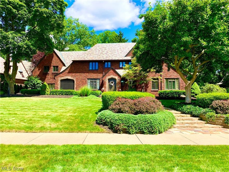 Absolutely Exquisite !!!!  Expect to be impressed at 1153 Sunset View Dr, a classic brick Tudor located in a well established neighborhood of West Akron.  This Home has many updates including but not limited to re-finished hardwood floors and staircase, painted professionally throughout, marble flooring in the Foyer and a recently added half bath on the main floor.  Upon entering you will be graced with the two-story foyer, Large formal Living room and dining room, ample space for all of your entertaining needs. Off of the Living room, you will find an enclosed 4-season sunroom beaming with natural sunlight.  Enjoy these lovely warm summer nights in the enclosed stone/morning room.  Enjoy cooking in the large eat-in-kitchen with newer stainless steel appliances.  Upstairs you will find five graciously large bedrooms which include the 22x15 Master Bedroom with a vaulted ceiling, recessed lighting and a gas fireplace.  The 4th bedroom has access with a separate staircase from the lower l