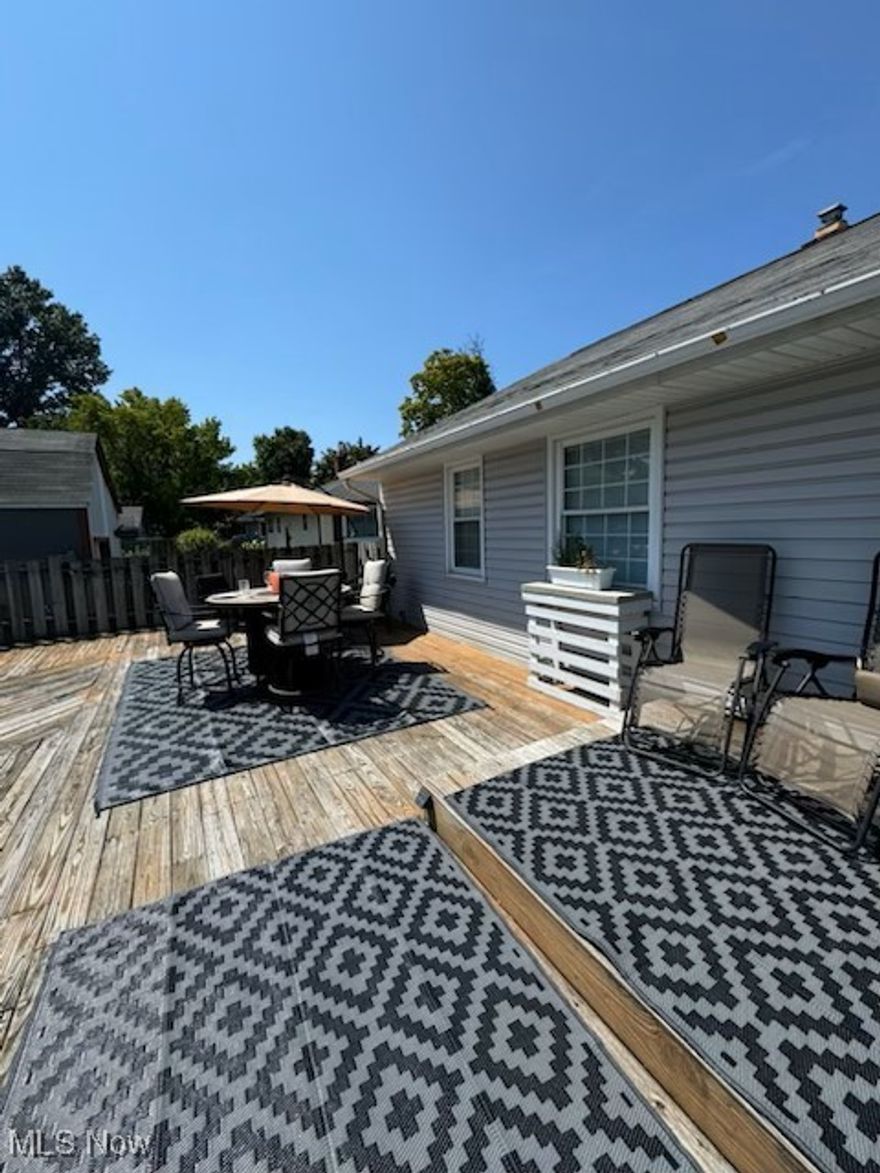 Welcome to this beautiful ranch style home! When you step inside the front door, you'll be greeted by a beautiful spacious living room with 4 large windows that bring lots of light to the space! The main floor has 3 bedrooms that are all carpeted, with 2 having built in closets. You’ll also find a full bathroom on the main floor with a spacious vanity as well as a newly finished full bathroom in the basement. The kitchen has new tiled backsplash with 2 windows which brings in the beautiful morning sun! Off the dining room, you’ll enter the backyard oasis which is perfect for relaxing and entertaining! With a large deck and 24” above ground pool, which has a new liner that was installed in 2023, you’ll relax and enjoy the sunlight this backyard brings! The fenced-in yard area bringing privacy and security. This home offers a 2 car detached garage with a shed attached in the back. Big enough to store all your outside furniture, pool supplies, outdoor equipment! The fully renovated basement has been waterproofed and has a lifetime warranty that transfers from owner to owner. This basement boasts new vinyl plank flooring as well as 2 carpeted areas, which could be used as a living area, office, gym.  Glass block windows were installed in 2023 which brings in some natural light and fresh air to the space. The laundry/utility area includes a new washer (2024) and dryer (2020) and plenty of storage space. This updated ranch is conveniently close to North Olmsted, Olmsted Township, and Westlake shopping as well as I-480! Come check it out and make this your home today