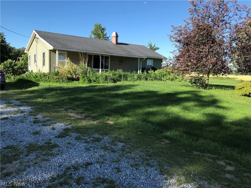 2 bedroom, 1 bath ranch home with nice hickory kitchen, laminate floors, fireplace in large living room, laundry/utility room, sliding door to concrete patio and the basement has some partially finished rooms.  This 2 acre property also has a 28'x28' pole barn and some other outbuildings and very few neighbors.  Windows are updated with newer furnace & hot water heater.
