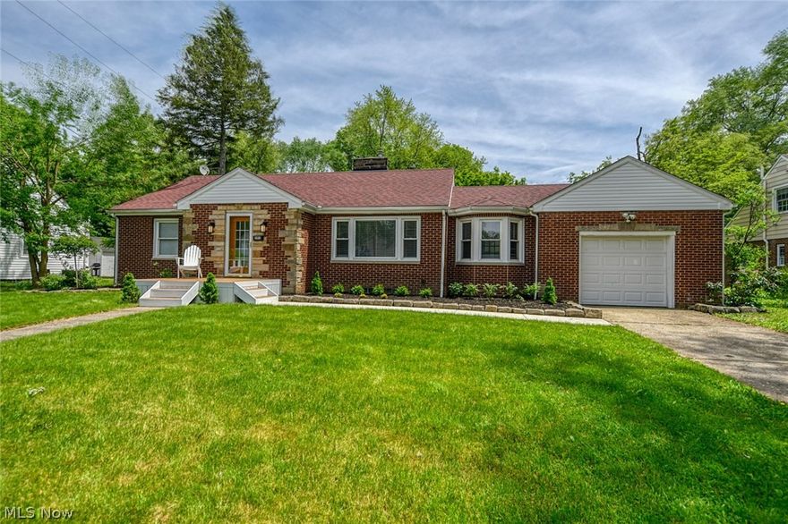 Absolutely picture perfect brick ranch in the Wallhaven area!  Right next to Elm Hill Park.  Fall in love as you walk up, with the fresh landscaping and new front porch. Enter through the new doors to your beautifully bright and crisp new home.  The spacious living room offers a wood burning fireplace and entry way with 2 closets (one is cedar!).  The refinished hardwood floors carry through the dining room, hall and bedrooms.  The large eat-in kitchen provides all of the counter space you could need, with gas range and refrigerator included.  In addition to the table space in the kitchen, there is also a gorgeous formal dining room.  Off of the dining room is the stunning sun room.  All new windows, fresh paint, brand new tile flooring, ceiling fan and sliders to the yard, makes this THE place to be in this home!  Back down the hall way are 2 nice sized bedrooms and a classically finished full bath.  There's even more space on the lower level!  A massive family room with wood burning