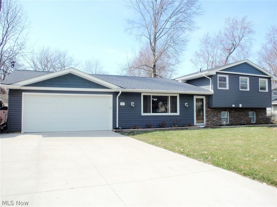 Beautiful split level with vinyl siding accented with sandstone at the front of the home.  Many improvements over the last 11 years include vinyl windows, roof, HVAC, life proof vinyl flooring in living room, dining room, family room and kitchen.  Kitchen has been updated with lots of cupboards and granite countertops.  The stainless steel appliances are 1.5 years old (only 1 refrigerator will remain)  Sliding patio door to a fabulous 20 x 20 covered wood deck - has vaulted ceiling and fans for all your entertaining.   Lower level family room has recessed lighting and life proof vinyl flooring.  Half bath and laundry room are on lower level as well.  The laundry room could be finished to allow for 4th bedroom if needed.  Concrete driveway within the last 11 years is 3 cars wide so you have extra parking.  The backyard is privacy fenced - seller owns back and north side - south side fence belongs to neighbors.  Ceiling fans in all 3 bedrooms, living room, dining room and kitchen.    2 c