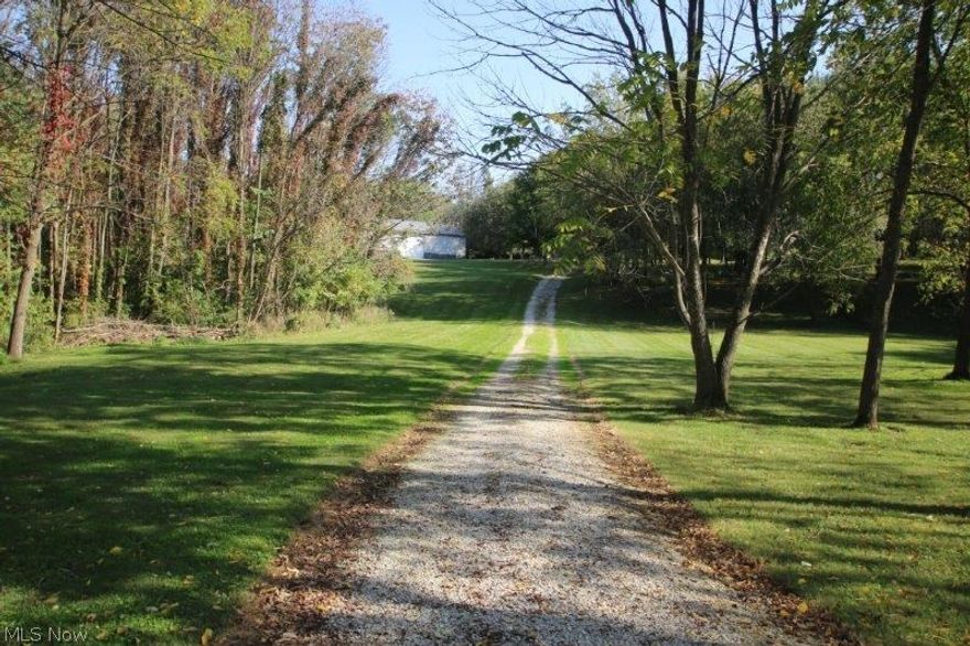 Beautiful private wooded hillside lot is located approx 5 mile west of Mt Vernon off of St Rt 229. The property has a long winding driveway, 64'x40' heated insulated hobby barn, cleared building site, and underground electric service to the building. The building has a concrete floor, service door, large door, and radiant propane heat. Great location with an easy commute to Columbus.