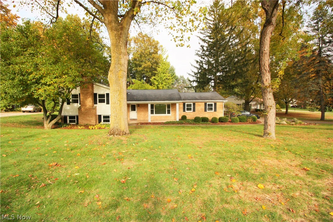 Welcome home to this spacious 4 bedroom split level. Enjoy gorgeous view of the woods from the sunroom. Perfect for entertaining you have 2 family rooms, one on the first level and the other in the lower level with a fireplace. You can pull into the 2 car garage this winter and enter the home out of the snow. The home is move in ready. Enjoy this home the day you close. The location is in the heart of Kent. Easy access to the KSU, Dix stadium, 261, Summit road, 59 and 43. Take 261 to 43, Tallmadge or Cuyahoga falls. Take 59 into Kent or to Stow. Grab summit to 43 or to 44 and get on route 76. The lower level has a room that is currently used as an office, but can be converted to another bedroom. Don’t miss this one…quiet location, large wooded lot and quick access to everything. Call today for a private showing