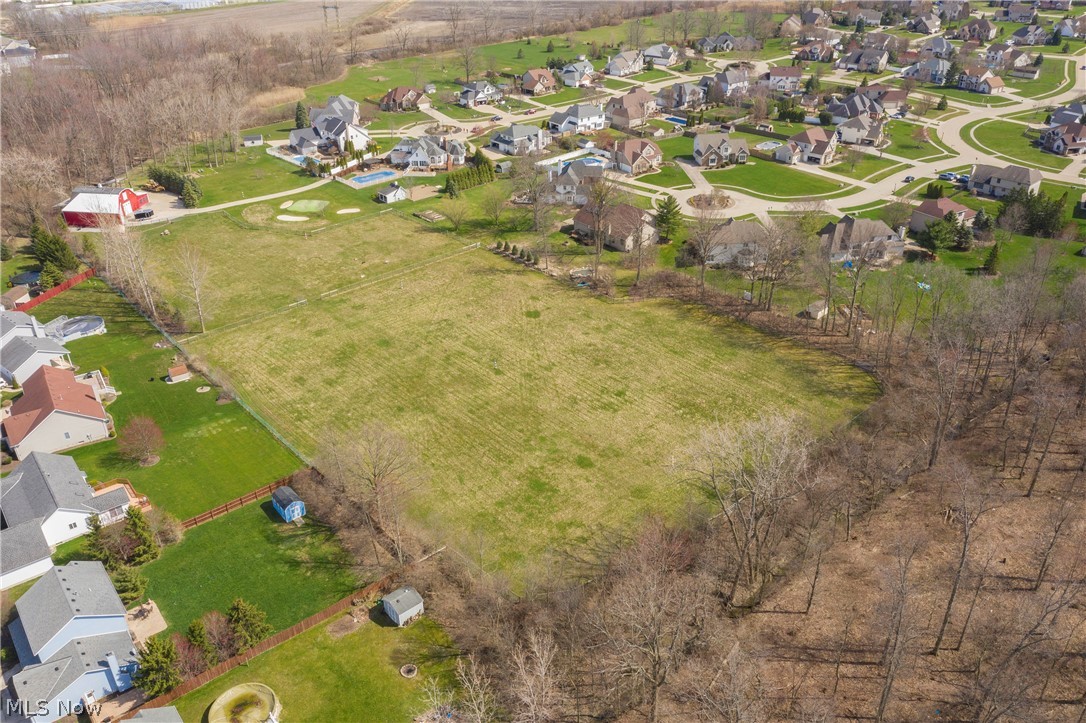 Must be purchased with MLS#4180600 - 5310 New Haven Ct, Sheffield Village 44054 listed at $650,000. Amazing 7+ acre property with heated barn, chicken coop, livestock, Par 3 golf, fruit trees and so much more! Heated, finished barn has motor home accommodations, 5 car bay and 12 car parking lot. Basketball court, horseshoe pit, volleyball, batting cage, and fire pits on the grounds. This is a one of a kind must see property - make and appointment today!