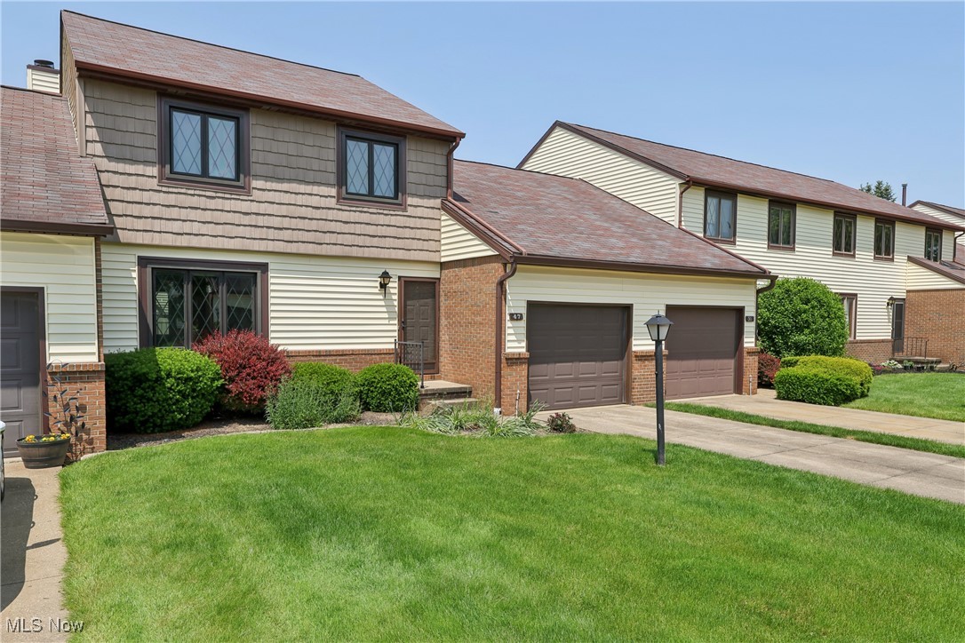Welcome to easy living in this beautifully maintained 2-bedroom, 1.5-bath condo in a prime Kent location—just minutes from shopping, dining, and convenient highway access! The bright kitchen features a cozy eating area and flows into a formal dining room and spacious living room with a charming fireplace and built-in bookshelves, plus direct access to your private patio—perfect for entertaining or relaxing outdoors. Enjoy the privacy of vinyl fencing and the convenience of a first-floor laundry and an attached garage. Retreat to the huge primary bedroom, offering three generous-sized closets and plenty of space to create your own peaceful sanctuary. The updated main bath boasts a luxurious Jacuzzi tub, and newer carpet runs throughout the home, giving it a fresh, modern feel. Community amenities include a heated outdoor pool, clubhouse/party center, scenic lake with walking trail, fishing, and non-motorized boating. The HOA covers landscaping, snow removal, water, trash, basic cable & Wi-Fi, pest control, and exterior maintenance—giving you truly carefree living! Don't miss your chance to own this turnkey condo in an unbeatable location!