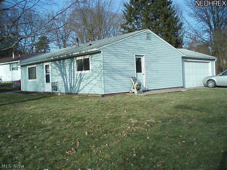 Ranch home in move in condition. This vinyl sided home features living room with new carpeting, kitchen including new refrigerator, 3 bedrooms and bath.  Flooring, carpeting, and paint in all rooms is new. Two car attached garage. Corner lot, near park. Shows well. Very neat and clean.