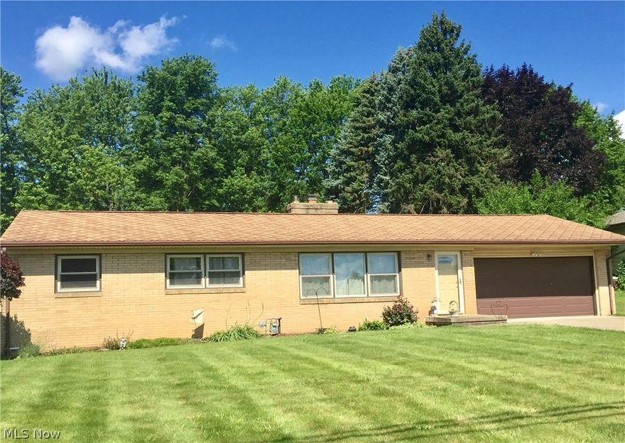 Affordable Brick Ranch with many updates in Jackson Township!  This one owner home shows pride of ownership, hardwood floors throughout, large living room with beautiful brick fireplace and large picture window.    You’ll love the updated kitchen with quality wood cabinets, solid surface counters and stainless appliances.  Park like backyard with patio, driveway has turnaround area for easy exit and a oversize 2 car garage.   Full basement with newer glass block windows, water softener, washer and dryer.  Updates include: furnace, air, hot water heater, sliding door, entry door, some windows, and 100 amp elec. (new insulation added in 2016).  Ideal for first home buyer or investment property -  can easily be rented!  Close to shopping, restaurants, St Hwy 77 and CAK airport