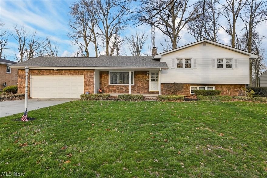 Welcome to 130 Robinwood Dr, where space, privacy, and potential come together on a quiet street in New Middletown. Tucked away with no neighbors behind, this split level home offers a peaceful setting on nearly half an acre, giving you room to relax, entertain, and make it your own. Step inside and you will find 1,780 square feet of living space ready for its next chapter. The layout offers great flow, an attached two car garage for convenience, and a solid foundation that is just waiting for your personal touch and modern updates. Out back, the fully fenced yard is perfect for pets, play, or hosting summer get togethers on the large patio. There is even a shed for extra storage, because let’s be honest, you can never have too much of that. And then there's the bathroom. A true time capsule moment featuring bold red tile that makes a statement you will not soon forget. Love it, lean into it, or plan your dream renovation, either way, it is a conversation starter. With a welcoming front porch, a quiet location, and strong bones throughout, this home is the perfect opportunity to create something special in the desirable Springfield Local School District. Bring your vision, your Pinterest board, and maybe a paint brush, this one is ready to shine again.