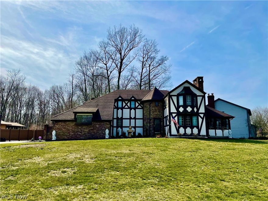 Looking for Character, Charm, & Space?? Look no further than this Charming Tudor with custom Brick Turret entry! Walk into the foyer with leaded glass doors leading to the Warm and bright Living room with fireplace. Make your way to the formal Dining Room w/ hardwood floors that leads to the updated eat-in Kitchen with granite counters and stainless appliances. Open to the kitchen and a cozy Family room with another Brick fireplace and vaulted ceiling. A private office with stainless window completes is conveniently located off the family room. Upstairs you'll find 3 bedrooms including an enormous Master Suite large enough to do whatever your mind can imagine. The Master Bathroom shows off the vaulted Turret ceiling with double sinks, granite counters and walk-in tiled shower. The upstairs Guest Bathroom is also updated with double vanity's. The basement has a finished Rec Room, large laundry space and plenty of storage. Off the Dining room is another custom 3 season room with tiled fl