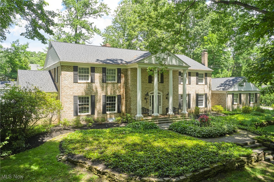Welcome to this stunning 5-bedroom, 5 full and 2 half bath brick colonial in the highly sought-after Fairlawn Heights neighborhood of West Akron. Completely renovated and offering over 6,100 sq ft of total living space on a private 1.21-acre lot, this home is designed for luxurious living and effortless entertaining. The resort-style backyard features an inground pool, cabana house with full bath, outdoor kitchen, and fireplace. Inside, the gourmet kitchen boasts top-of-the-line appliances and walk-in pantry. Enjoy multiple living spaces including spacious formal living, dining room, as well as a cozy family room with fireplace. A serene 3-seasons porch overlooks the backyard, while the first-floor primary suite offers a private office, spa-like bath, dressing room, and slider to rear patio. Four additional bedrooms, three full baths, and a loft complete the second floor, accessed by both front and back staircases. The finished lower level includes a rec room with fireplace, theatre room, fitness room, and full bath. Additional highlights include laundry rooms on both floors and a 3-car garage, all in one of West Akron’s most prestigious communities.