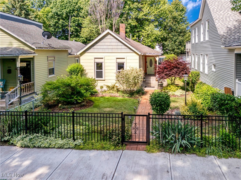 Welcome to this beautifully updated 3-bedroom home nestled in the heart of Ohio City. Behind the front gate, a lush, landscaped yard invites you toward a welcoming covered porch—perfect for enjoying your morning coffee or greeting guests. Step inside to discover a stunning open floor plan filled with character and architectural charm. The spacious living room flows effortlessly into a formal dining area, offering the perfect layout for both relaxing and entertaining. The bright kitchen, with its elegant white cabinets and ceramic tile backsplash, is both stylish and functional. The owner’s bedroom is a peaceful retreat, flooded with natural light and accented by modern barn doors. Two additional bedrooms and a full bathroom with a tub and vanity provide comfortable space for family or guests. A cozy bonus room makes an ideal home office or creative nook, and a dedicated laundry room adds everyday convenience. Outside, enjoy your own private backyard oasis, complete with a gazebo, patio, fire pit, and newly added concrete area that functions as a mini driveway. It's the perfect spot to unwind or entertain on warm evenings. Recent upgrades include: a remodeled bathroom, reinforced and updated kitchen flooring, new interior doors, upgraded laundry room with new flooring and carpet, freshly repaired and painted interior walls, a fully redone front porch with new concrete steps and flooring, updated rear landscaping and patio, installed gazebo, and new front and back gates. Located just minutes from beloved local spots like Edgewater Park, The West Side Market, Tremont, and downtown Cleveland, this home blends classic charm with modern updates, offering a truly move-in-ready gem in one of the city’s most vibrant neighborhoods. The seller is offering a one-year America’s Preferred Home Warranty.