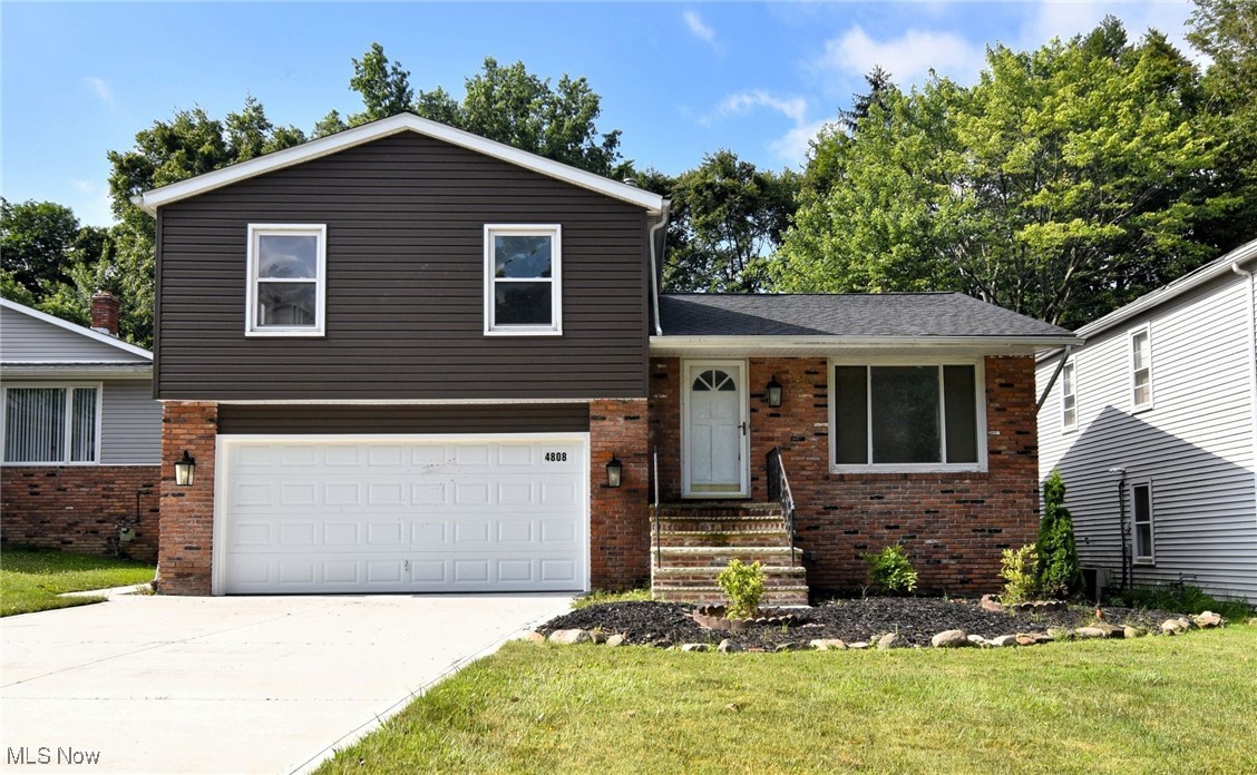 Step into this thoughtfully updated split-level home featuring 4 spacious bedrooms and 3.5 bathrooms, including a convenient first-floor bedroom—ideal for guests, in-laws, or a home office. The heart of the home is the open-concept kitchen, beautifully appointed with sleek stainless-steel appliances and modern finishes. It seamlessly connects to the cozy family room, complete with a fireplace—perfect for everyday living and entertaining. Upstairs, you'll find generously sized bedrooms, including a comfortable primary suite with its own private bath. The lower level adds even more living space with a large rec room and a fully remodeled bathroom—ideal for movie nights, a playroom, or a home gym. Enjoy the outdoors in the spacious backyard, featuring a patio that’s perfect for summer BBQs, family gatherings, or just relaxing in the fresh air. Blending comfort, functionality, and style, this move-in-ready home is designed to fit the needs of modern family living