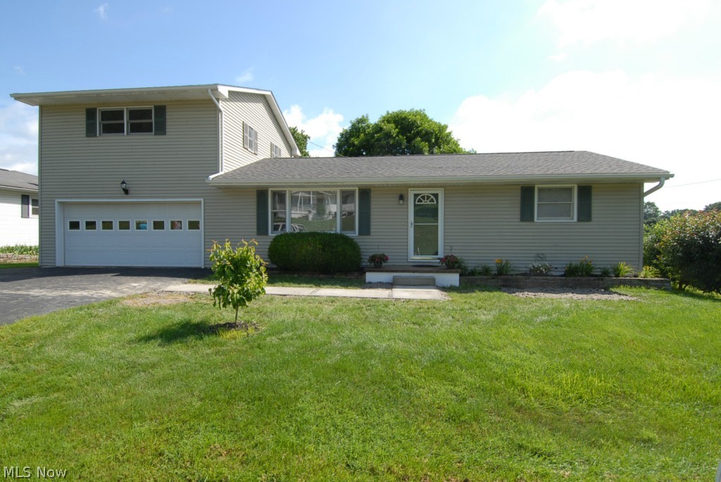 Everything You Want! Comfortable floor plan and nicely updated interior offers open living room, fully equipped kitchen with dining area offering brand new patio doors that over look back yard with awesome deck and mature landscaping. The back yard and deck is another complete room of its own. 2 bedrooms and full bath includes laundry room located on main floor. Upstairs offers private office/den with new french door to 2nd level deck with access to lower deck and back yard. Owners suite offers private bath and walk in closet. Dual furnace for efficient utilities. Invisible pet fence surrounds the complete yard. New roof in 2013 and new gutters 2012.