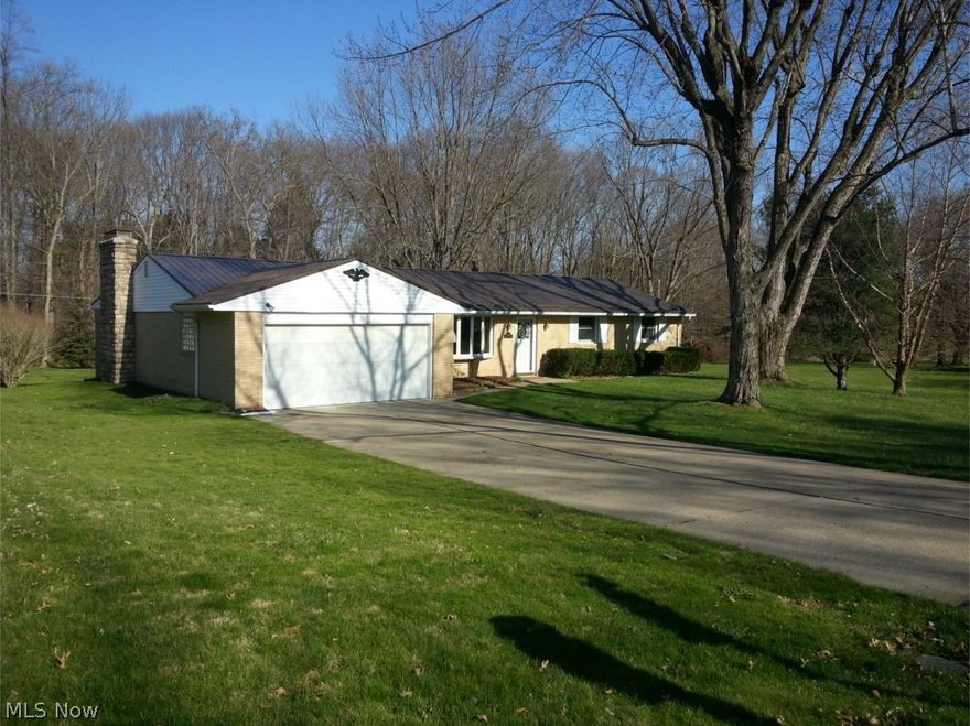 Beautifully updated brick ranch on a private 1/2 acre lot.  Updates include:  Steel roof - 2013, all windows (except master bath) replaced between 2000-2005.  Sunroom addition w/ cathedral ceiling in 2000.  Family room & kitchen extension in 2000.  Total kitchen update includes: cherry cabinets, corian counter tops, breakfast bar, oak hardwood floor and all appliances.  Neutral paint thru out in 2014.  Kitchen is open to dining area, family room & 3 season room.