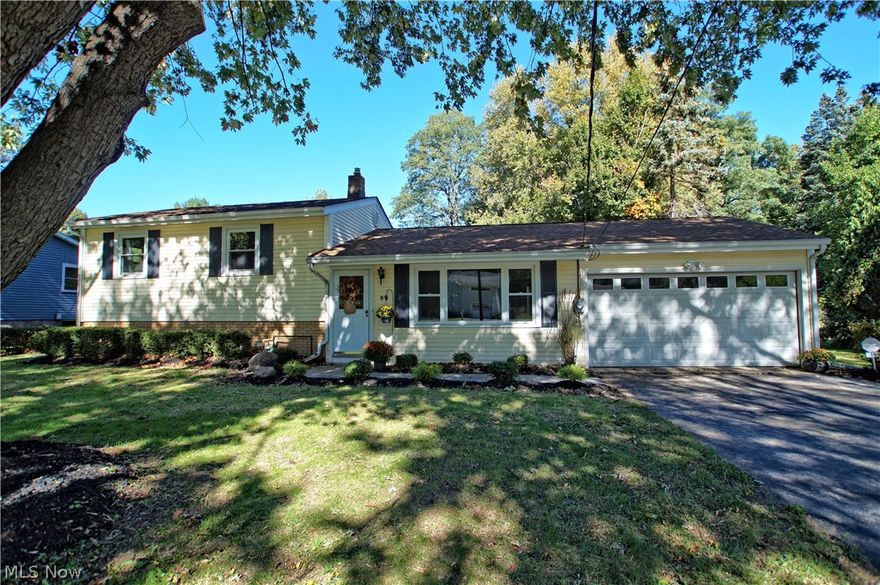 PREPARE TO BE WOWED!~ One of a kind move in ready showpiece!  Fully renovated with designer details and flair throughout.  Step inside to this open concept floorplan  with ample living room with tons of natural light.  Separate dining area has access off of garage and sliders leading to rear sun porch and patio to add to your living space.  The kitchen is the heart of this home with high end cabinetry, custom tile backsplash, granite, and SS appliances with room for added seating at counter.  The bedrooms can be found upstairs with the owner suite having a half bath attached.  Large built ins for added storage and loads of closets and storage.  The lower level has a walk out and daylight windows with a cozy yet modern feel.  Separate storage area and additional laundry room complete this space. Fantastic yard with shed and privacy. NEW*High end Super plush carpeting*Luxury Vinyl Flooring*All Fixtures*Hardware*Lighting*Granite*Tile*TOO MUCH TO LIST and NOT TO BE MISSED!