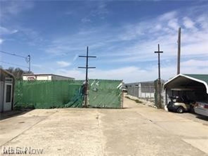 Searching for investors! Massive two parcels consisting of nearly five acres offering unique business opportunities, currently used as a salvage yard, buildings on property include garages with work bays, storage buildings, majority of the parcel(s) is paved with concrete and fenced. Easily accessible from major highway(s) Discover the potential today!