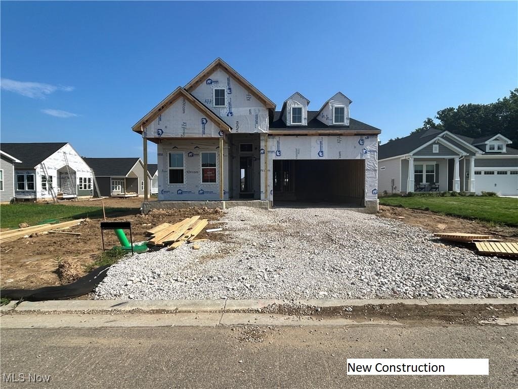 This is it—the last Tacoma, our largest floorplan, being built in Heritage Park! If you’ve been waiting for the perfect moment, Lot 8 is the one you’ve been hoping for. Nestled on a cul-de-sac, this homesite offers a backyard stretching 110 feet from the covered deck and no neighbors directly behind! The Tacoma’s soaring vaulted great room, anchored by a gas fireplace, makes a bold impression, while the 3-car tandem garage provides space for parking, storage, or hobbies. The unfinished basement is full of possibilities (beyond ample storage), with larger daylight windows and rough-in plumbing for a future full bath. Thoughtfully selected finishes elevate the feel: white shaker cabinets, brushed granite countertops, brushed nickel fixtures, and a spa-inspired primary shower with tile stretching to the top of the 10 foot ceiling and a frameless glass door. Standard features go well beyond the norm—tray ceilings, irrigation, landscaping, covered porches, 10 ft ceilings, 8 ft doors, 6 ft windows and maintenance-free exterior materials. But what truly sets this home apart is the lifestyle it offers. No more mowing, no more snow shoveling—just time to enjoy your home and everything the area has to offer. For $145/month, the HOA handles the hard work. With a 10-year structural warranty and 1-year fit and finish coverage, you’ll enjoy total peace of mind. This is more than your last chance for a Tacoma— it’s your chance to slow down, settle in, and truly feel at home.