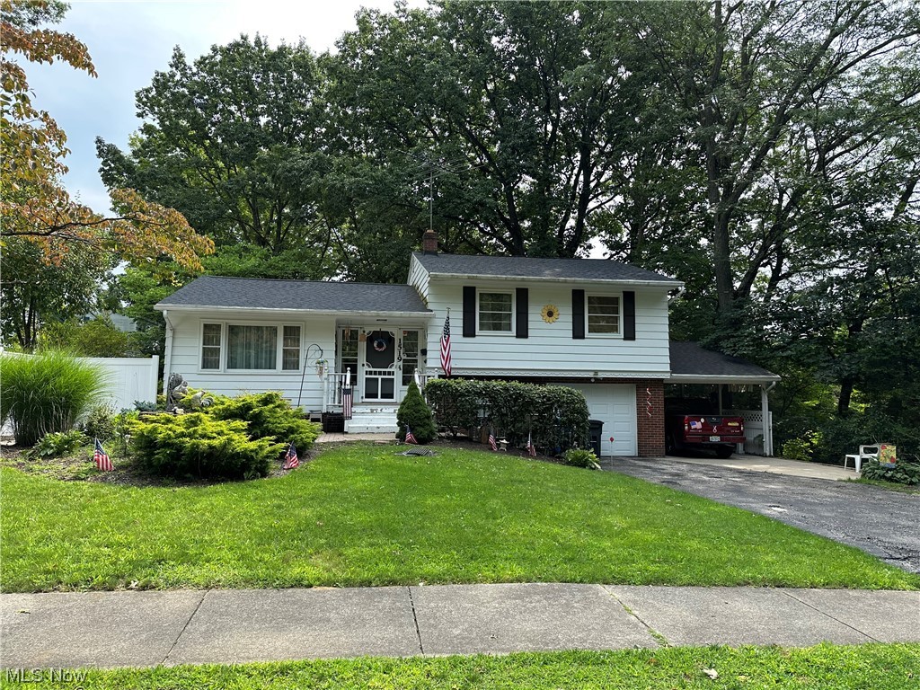 Lots of potential in this spacious split level in the heart of Kent! Age and health has left a seller that has not been able to keep up. Spacious living room and dining area on the first floor (look past the bed that is in those rooms). Under all of the carpet throughout most of the house are hard wood floors! An addition off the back of the house is roughly 10 years old, and provides another fabulous space that looks out over the tranquil wooded back yard. Upstairs has the 3 bedrooms and the full bathroom. As you leave the kitchen, and go down a few steps, you enter the heated/AC garage and laundry room, along with a half bath. (Imagine this.....What a fabulous opportunity to finish that space into a massive living space!) Current seller doesn't use it as a garage, as she uses the attached carport instead. From that garage area, go down another level to a finished recreation room that is roughly 24x13. There are two patios that are perfect for gatherings or just to enjoy outside l