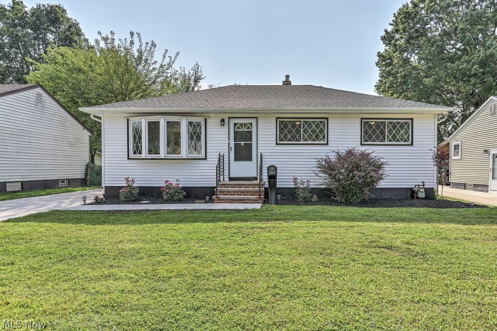 Lovely Fully Remodeled Ranch In Highly Desirable Location of Brook Park! Newly Restored Hardwood Floors Gleam Throughout 1st Floor. Finished Basement w/ Full Bath. Brand New Vinyl Siding & Roof! Vinyl Replacement Windows, Central AC & Up to Date Furnace/Hot Water Tank. Laundry Room in Basement w/ Bar Area & Carpeted Recreation Room! Brand New Shaker Style Kitchen Cabinetry w/ GRANITE Counter Tops! Custom Subway Tile Shower Surrounds, LED Lighting & Luxury Vinyl Plank Flooring Complete the Newly Remodeled Bathrooms On Each Floor! Stainless Steel Appliance Package & Washer/Dryer Included! Front Bay Window Adds A Lot Of Charm. Brand New Driveway Is Extra Wide w/ Larger Back Patio. Newer Garage & Longer Back Yard Features Outdoor Fire Pit! Weed Barrier & Rubber Mulch Complete the Landscaping for a Maintenance Free Lifestyle, 12 Year Color Guarantee On Mulch. Furnishings Negotiable. Join the Neighborhood Now!