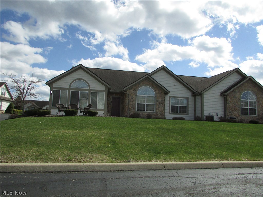A remarkable 3 bed, 2 bath ranch condo at The Crossings At Northwest in Tallmadge. This spotless unit is almost 1800 square feet of living space. The open great room is very large, and features a fireplace. The great room opens to a large sun room, dining area, and kitchen. The kitchen has ample cabinets and counter top space. The master suite has vaulted ceilings, double sinks, and a huge walk in closet. The 3rd bedroom is also an office option. There is a 2 car attached garage, first floor laundry, and so much more. Enjoy the pool, exercise room, and common rec center that can be reserved for family functions, receptions, etc.