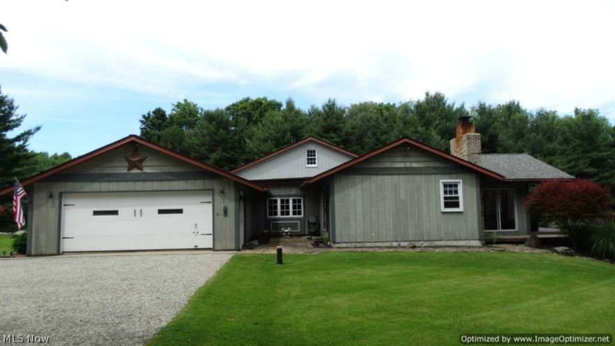Enjoy Country Living in this inviting 3 Bedroom & 2 Bath Ranch nestled on 5.75 Private Acres! Wonderful open floor plan with large 2-tiered deck & swimming pool makes this home ideal for entertaining. This home offers a Large Living Room with beamed ceilings & wood burning brick fireplace with insert. Dining Room with newer wood floors through to Kitchen with all appliances. Bright & Open Vaulted Family Room/Sunroom addition with wall of windows with access to deck that is partially covered. Master Bedroom with wood laminate flooring & Private Bath with ceramic floors. All bedrooms include ceiling fans. Office or possible 4th Bedroom with built-in desk & cabinetry. Large Breezeway/Foyer entrance. Laundry area with new flooring and washer & dryer stay. Newer Roof, hot water & pressure tanks. Freshly stained exterior, storage shed & 2-car attached garage. Beautifully landscaped park-like acres with lush plantings, mature trees, stone walkway & patio. Well maintained inside & out...schedule a showing today!