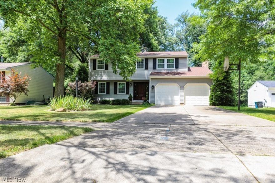 Welcome home to 1167 Erin Drive in Kent, OH! This 4 bedroom 2.5 bath Conventional style home has been tastefully updated and incredibly well maintained. On the main floor you will find a spacious living room and formal dining room combination with cork flooring, an updated kitchen with granite countertops and center island, a family room which is wired for sound with wood burning fireplace, and an 11x15 4 Season Room. Upstairs holds all four bedrooms and two full updated baths (2021) including the master bedroom with ensuite bath with walk in closet. The basement has been recently waterproofed 2024, with a new sump pump 2024, and an updated HVAC 2019. Exterior features include a 2 car attached garage, 16x20 shed, a well maintained back wooden deck, and a nicely manicured back yard with pond. Minutes to KSU and downtown Kent, this house is turn key MOVE IN READY! Schedule your private showing to see everything this home has to offer.