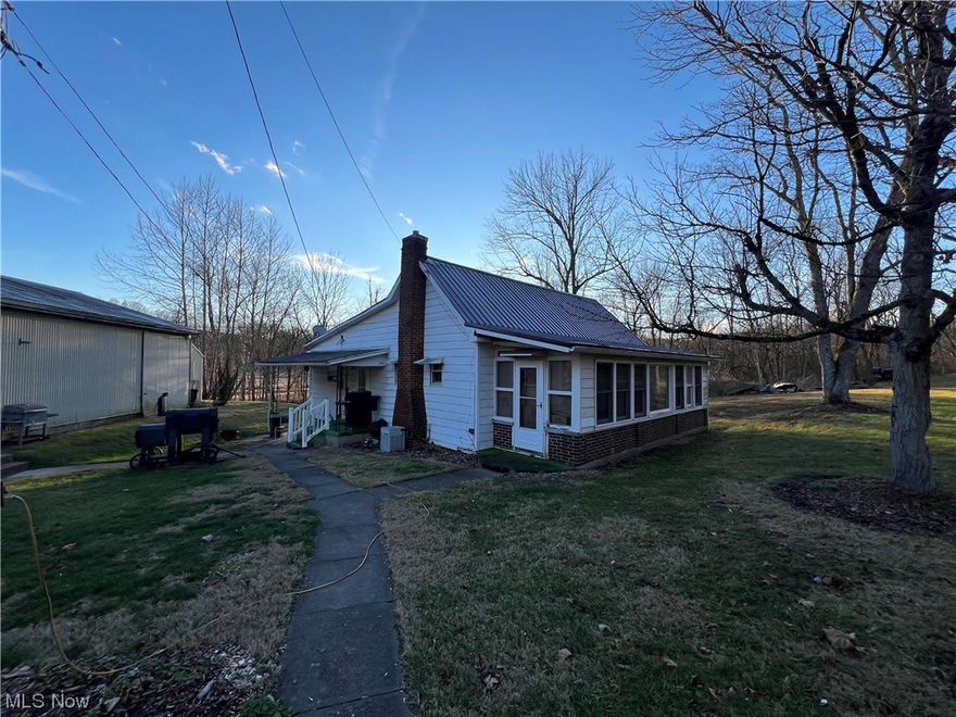 This is an Auction! Located just north Wolf Run State Park and Lake offering a 2-bedroom 1 bath home on almost 2 acres. This would make a very good starter home as well as offering good investment potential. There is county water and natural gas for heat and the home has central air. Other improvements include a pole barn shop with lean to and an RV campsite pad with 3-4 RV hookups with electric, water and sewer. There will be a property tour on Thursday, Feb. 29 @ 5:00 PM.