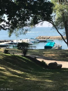 Beautiful Lakefront lot includes 2 boat slips (1 dock). This hilltop view overlooks private 18 slip marina and break wall. This is your opportunity to build your family's waterfront estate that they will enjoy for many years to come!