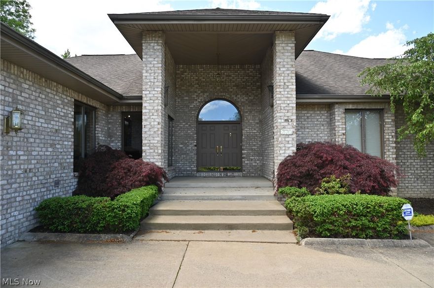 Stunning and rare opportunity, 3-bedroom, 4-bath ranch in an ideal Canfield location! This sprawling, 3100 square foot all-brick ranch home boasts a wonderful open feel with spacious rooms, vaulted ceilings and numerous updates throughout. Captivating two-story foyer as you enter the home, opening to a large and bright great room with a 2-sided fireplace, looking out to large patio thru double sliders. HUGE formal dining, sharing the fireplace. The large and fully-updated kitchen is complete with granite surfaces as well the nice-size island and plenty of cabinetry with all appliances staying. The eat-in kitchen (dinette area) is very bright with ample windows. A convenient and good-size office is positioned right off the kitchen.  Main floor powder room and spacious laundry room are down from the kitchen area. Down the opposite hall, the huge primary suite awaits you with a large  ensuite bath including a ceramic shower, jacuzzi tub and water closet as well as a nice size walk-in closet. The other two bedrooms share a Jack & Jill bath. If the main level isn't enough for entertaining, prepare yourself for another level of entertainment as you take in the basement level.  The fully carpeted "lower recreation room" has a large bar area, featuring Kraft Maid cabinetry, sink and microwave and plenty of room to mingle. A FULL BATH and large walk-in closet are added features in the finished lower level. The second half of the basement offers a HUGE expansive common area to fulfill all of your storage needs with many built-in shelves. (2) High-efficiency Carrier Infinity HVAC's.  The extra-large 2 1/2 car garage is plenty big for the biggest SUV's.  Exterior shed for all of your lawn & garden needs.  This home is in an ideal location to the swim club, Metro Parks bike path, all Canfield Schools, stores, restaurants and more! All this on an extra large, 3/4 acre lot, backing up the the bike trail.  This property being sold as is, due the situation.