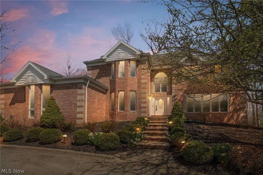 This stately Deerfield Woods Colonial makes a lasting first impression w/ it's full brick front, half circle driveway, oversized 3 car side load garage & private wooded lot! Elegant 2 story entry w/ new front door & tile, curved stairway & catwalk. A formal dining room w/ crown molding & hardwood floors leads you to the enormous eat-in kitchen that supplies newer granite countertops & sink, center island, planning desk, large dining space & included appliances. Step down to the family room w/ fireplace, hardwood floors & doors to a cozy nook w/ shelving surround. Private office w/ French doors & bay window, laundry room & a powder room complete the main level. The gracious turned staircase & open catwalk takes you to 4 sizable bedrooms, 2 full baths & attic access; showcasing the enormous master suite w/ raised tray ceiling, fireplace, huge walk-in closet & private glamour bath w/ double vanities, jetted tub & walk-in shower. A finished walkout basement w/ multiple recreation rooms, bu