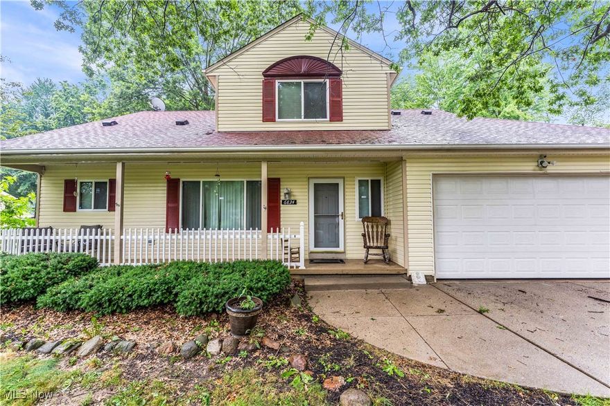 EXCEPTIONAL POTENTIAL ON PRIME HALF-ACRE LOT! This spacious 4-bedroom, 2.5-bathroom home offers incredible opportunity for the right buyer and is situated directly across from a beautiful park, combining privacy with convenience in desirable North Ridgeville. The home features a generous master bedroom with large en suite bathroom and private sliding door access to a deck, perfect for morning coffee or evening relaxation. The heart of the home is an extremely large, open great room that's ideal for entertaining, complete with a cozy fireplace as the focal point and sliding door access to the deck for seamless indoor/outdoor living. The dining room overlooks the great room, creating excellent flow for daily living and entertaining guests.
Practical features include a convenient first floor laundry room, eliminating the need to carry laundry up and down stairs. Upstairs, you'll find three well-sized bedrooms and a full bathroom, providing plenty of space for family or guests. The clean, unfinished basement offers endless possibilities for customization - whether you envision a home theater, workshop, recreation room, or additional living space. This property is being offered at a competitive price that reflects its current condition and the TLC needed, making it perfect and ready to customize into your dream home. Don't miss this chance to own a spacious home with tremendous potential on a beautiful lot in a great North Ridgeville location!