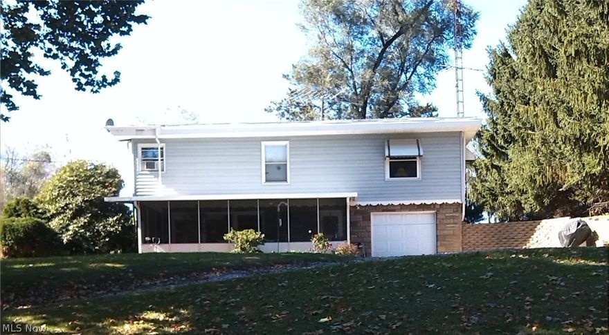 Looking for a country setting? Minutes from Bolivar and Canton South. Fully equipped kitchen, nice screened in porch, enjoy sunrises and wildlife, convenient one stall attached garage. Great starter home!