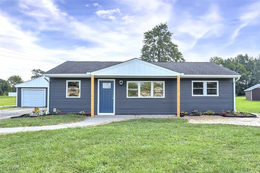 Discover this stunning completely remodeled three-bedroom ranch, set on a generous .58 acres of lush green space. This home has been thoughtfully updated with new siding, windows, and gutters, ensuring a fresh and modern exterior. As you enter, you’ll be welcomed by new vinyl flooring that flows seamlessly through the living room and kitchen, complemented by new carpet in the bedrooms and fresh paint throughout. The living room features recessed lighting, creating a bright and inviting atmosphere. The heart of the home is the gorgeous kitchen, showcasing new cabinets, butcher block countertops, and stainless steel appliances, all designed in an open concept layout that is perfect for entertaining. The fully remodeled bathroom is a true highlight, featuring stunning tub-to-ceiling tile and a new vanity that exudes elegance. Step outside to enjoy the spacious two-car garage, a charming front porch, and a back patio that is ideal for hosting gatherings. The back family room offers a rustic charm with a wood-burning fireplace, providing a cozy space to unwind while overlooking the tranquil backyard. This home combines modern updates with a warm, inviting atmosphere, making it the perfect retreat for anyone seeking comfort and style. Don’t miss the opportunity to make this beautifully remodeled ranch your own!