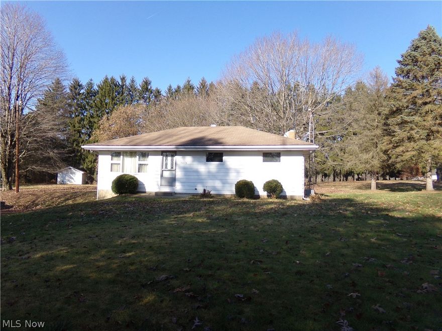 With endless possibilities, this adorable 3 bedroom, 1.5 bath ranch offers peace and serenity to any country lover. This must see home is situated on over 12 acres of land  that is conveniently located near State Route 11 and is only one exit away from Calcutta, OH.  This home offers a cozy eat-in kitchen that overlooks the beautiful back yard.  Attractive textured ceilings are boasted throughout the entire home.  While one bedroom already has the gorgeous hard wood floors exposed, the other bedroom as well as the living room are simply waiting to be uncovered.   Need room for your equipment or toys? This well maintained home offers an attached 2 car tandem garage as well as an additional 24X32 detached garage. Priced to sell, this piece of heaven won't last!  Schedule your private tour today.