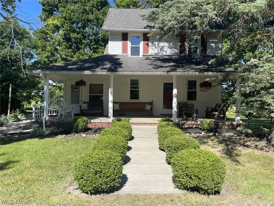 This unique property, situated on over 5 acres, located in Nimishillen Twp/Louisville Schools is waiting for you! The kitchen and dining room were remodeled in 2005 & the updates modernize the farmhouse feel! Open and spacious for holiday parties and entertaining, wood floors, crown molding, wrapped columns, raised breakfast bar, tile backsplash, new refrigerator in 2019. Beautiful French doors open from the dining room into the cozy living room. Off the kitchen you’ll find a bedroom which could be converted into a first floor office. The bright, four-season sunroom opens to patio…another area utilized for entertainment or just simple relaxation. The 1st floor also features a full bath/laundry room. The 2nd level features 3 sizeable bedrooms/1 full bath and snug reading area with built-ins. One of the bedrooms was used years ago as a kitchen & could be converted back to that or into a utility room as there is a washer/dryer hook up. Upper level also has its own private entrance. One can use his own imagination for the second floor space! The home boasts a welcoming front porch with cathedral-like ceiling as well as back patio for your private gatherings, small or large. Ample parking plus 3-car detached garage/barn for all the lawn toys and recreational vehicles! You will have endless hours of fun exploring the extensive wooded acreage. Well pump and sump pump new in 2022, HWT 2024, double hung windows throughout. Home is being sold As-Is. This charming house holds many beautiful memories made by the family and friends of the current owner and now it’s your turn to begin making memories of your own!