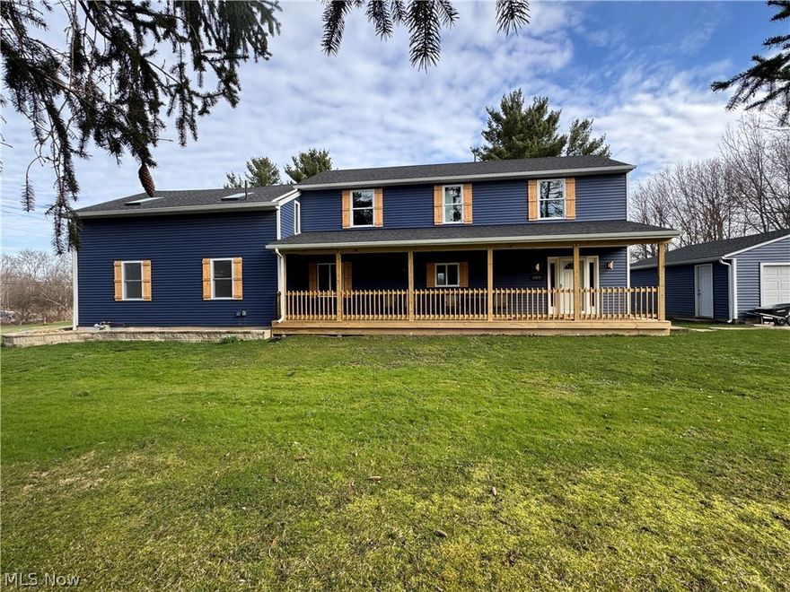 Back to market with a fully waterproofed basement! This stunning 4-bedroom, 3.5-bath masterpiece is situated on 2.11 beautiful acres in highly sought-after Kirtland. This exceptional property offers the perfect marriage of historical character and modern conveniences. The original structure has been meticulously renovated and enhanced with an expansive NEW construction addition. Every system and surface has been thoughtfully updated (siding, roof, electrical, plumbing, HVAC, and septic system). High-end finishes throughout showcase exceptional attention to detail and quality craftsmanship. Step inside to discover SS appliances, premium fixtures, and designer touches at every turn. Enter through the spacious mudroom to the massive, chef-inspired kitchen. This is truly the gathering place for family and friends. The large inviting family room features a charming wood-burning fireplace while the convenient first-floor master suite offers main-level luxury living, an ensuite full bath with ceramic surround shower, and a large walk in closet. Upstairs, you'll find a dedicated flex room/office with three additional large bedrooms, each offering exceptional closet space, and 2 full baths. Outdoor living is equally impressive, featuring a covered front porch ideal for morning coffee and a massive 4-level deck spanning the rear of the property - perfect for taking in the serene surroundings.  The 2-car garage includes a workshop space for weekend projects! Adding to the home's historical character, the beautiful sandstone used for the exterior steps and retaining walls was carefully salvaged from the original 1830s foundation, a thoughtful tribute to the property's rich heritage that connects past and present in a truly meaningful way. This is a rare opportunity to own a completely renovated, new construction, move-in-ready home where historic charm meets modern perfection.