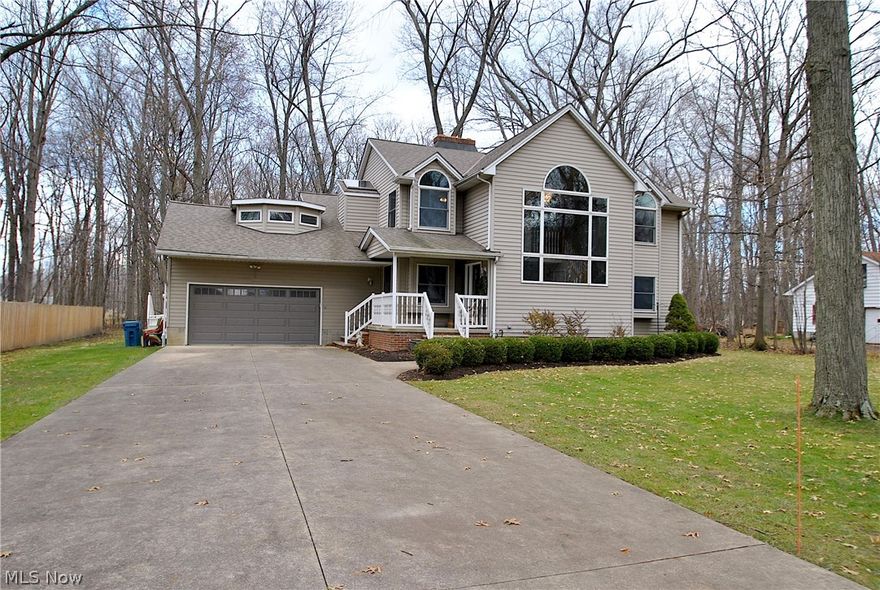 Welcome to this 5 bedroom, 2.5 bath home on 2 acres in Willoughby where you get a country feel and city amenities! The best of both worlds! Privacy and room to roam, yet minutes to Route 2. You'll love this spacious 2 story home with recent updates throughout! The foyer entry features a wall of windows and soaring ceilings. The beautifully remodeled kitchen (2015) is open to the family room with hardwood floors (2015). You’ll find 2 staircases (one in the foyer and one in the kitchen area) that lead you to the spacious second floor complete with a cozy loft, master suite with glamour bath, and 3 additional bedrooms. The walk in second floor attic is insulated and provides plenty of storage. Some other updates are roof (2016), bathroom remodels (2015 & 2016), carpet (2019), all on a wooded and landscaped yard. Stay warm with wood-burning fireplaces in both the livingg room and LL rec room until summer returns and you move the party on your deck overlooking the private backyard with above ground pool. Easy to show...don't pass this one up...make your appointment today!