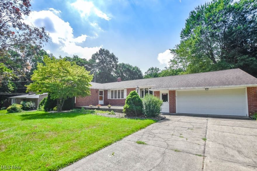 True one-floor living awaits in this spacious all brick Plain Township ranch! Step inside to discover an open concept living & dining room flooded with natural light, thanks to the large picture windows in each of the rooms The refreshed kitchen features updated countertops with an integrated backsplash & matching white appliances, along with counter seating for casual meals. Adjacent to the kitchen is the cozy family room, complete with built-in media storage & a sliding door that opens up to an amazing enclosed patio with walls of windows providing a panoramic view of the backyard. Down the hall you'll find three nice-sized bedrooms & two full baths which includes the master with a private en suite with a walk-in shower. No more lugging laundry up & down stairs - the convenient first-floor laundry is easily accessible in the hall leading to the attached 2.5 car garage. If you need additional living space, the full basement offers plenty of potential to be finished or could just be used for storage. Outside, you'll appreciate the wonderful yard, which spans over half an acre. There are two outdoor spaces to enjoy - a newer front patio overlooking the friendly neighborhood & an extended stamped concrete patio in the private tree-lined backyard for peaceful relaxation. The location is simply unbeatable, centrally situated to all Plain Township & North Canton amenities with easy access to parks, restaurants, & shopping! Schedule a showing today & make this house your new home!