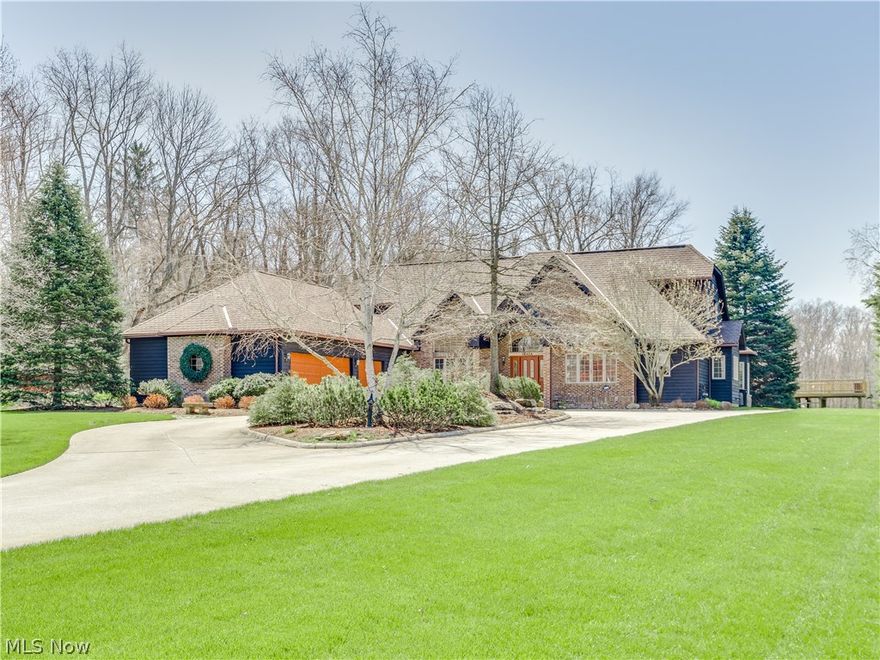 This is one of Sagamore Hills most beautiful homes. Its 4132 square feet are situated on 4.5 acres. A 300 foot concrete drive leads up to a gracious two story covered front entry. The front elevation is all-brick and is complemented by a three car heated garage with oversized raised panel doors. Every room is open, light and vaulted. Great room and Living room with walls of windows, 2 sided, floor to ceiling fireplace goes through to each room. Gourmet kitchen with stainless appliances and granite countertops. Vaulted master bedroom with sitting area. Master bath boasts duel sinks, vanity seat and jacuzzi tub. 13 course finished lower level. ''Ship-lapped'' hickory flooring, custom milled poplar window and door casings, solid poplar doors, central vacuum are just a few of the home's highlights. Gorgeous back deck opens to paved patio and fire pit. Pristine lawn, water feature, underground pet fence and above-ground pool with deck built around. Attention paid to every detail, don't miss