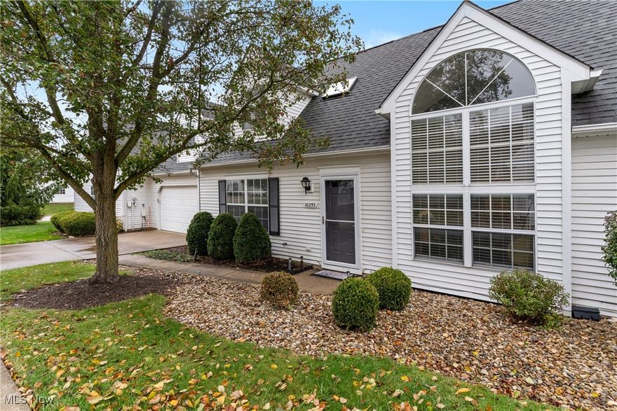 Tucked away from busy streets for added privacy, is this beautiful, light-filled Cape Cod style condo in Ethan’s Green. Step inside to discover bright and inviting living spaces with crisp neutral paint, and plenty of natural light. The main level features an open concept Living Room with a vaulted ceiling and palladium window and the adjoining Dining Room with sliding doors to the backyard Patio ideal for relaxing, grilling, and entertaining. The galley style Kitchen has a center island, a full suite of ss appliances, along with lots of cabinetry, storage and recently installed quartz countertops. The convenient Eat-in area has sliding doors that access the Patio and backyard area and bring the outdoors in. Also on the first floor, is a Bedroom with a walk-in closet that’s perfect for one floor living or guests, a home office, or craft room along with the convenient Laundry and utility rooms, connecting to the 2-car attached garage with recently installed man door. Upstairs is generous sized Primary bedroom providing ample closet space, vaulted ceiling and a ceiling fan. The oversized 2nd full Bathroom has a stall shower and large vanity area. The Loft area stays bright with skylights and offers flexible options for a reading nook, office, or additional sitting area, while the spacious Bonus Room adds even more living space. Experience comfortable living in the desirable Ethan’s Green community, located just minutes from shopping, dining, and highway access in the heart of Twinsburg.