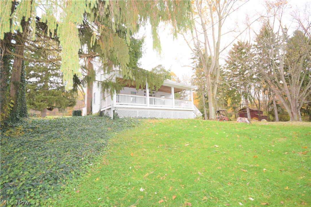 Three bedroom, 1 bathroom Century home sitting on a 3.6-acre lot in Doylestown. This private home is located in a country setting, surrounded by trees and farms. You will love the large, covered front porch -- it's the perfect spot to sit and overlook the peaceful, beautifully landscaped property. The house has new flooring and carpet (hardwood under carpet). Spacious eat-in kitchen, living room, and a bonus family room. Along with the detached 3-car garage, there are 3 extra sheds offering you even more storage space. This house also has a slate roof -- which are known to be beautiful, durable, fire resistant, and environmentally friendly. You will be impressed by this charming country home!