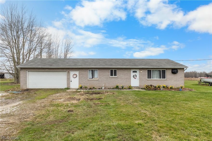5.8 acres of rural living with room to breathe! This brick ranch, built in 2003, offers true one-floor living with 3 bedrooms, 1.5 baths, and a convenient laundry area just off the attached 2-car garage. Home features include eat in kitchen, spacious living room. 

With approximately 100 ft of frontage and stretching back nearly 2,500 ft, this property delivers space, privacy, and endless potential for outdoor enjoyment.

Priced to reflect current market conditions. seller may set a highest and best offer deadline. Don't miss your opportunity to secure acreage with a solid home already in place.