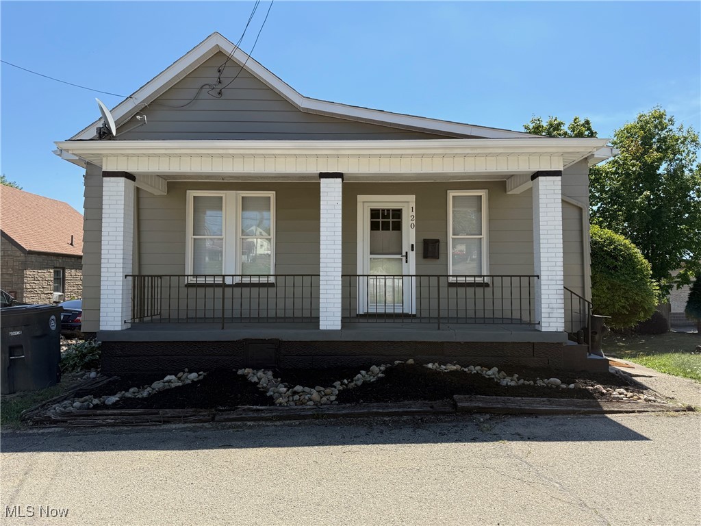 Don't miss this Cute and conveniently located and immediate possession home. Living room and 2 bedrooms have had the original hardwood floors refinished and look great.
The windows and roof have been replaced. Newer stove and refrigerator stay. There is an enclosed back porch which can be an office or Dining room and a front covered porch to sit and relax on. Driveway has room for a few cars and there is off street parking also. The third bedroom is captive. Good investment property . CALL TO VIEW.