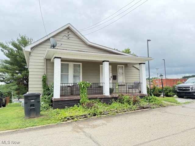 Cute and conveniently located. Living room and 2 bedrooms have had the original hardwood floors refinished to a beautiful finish.
the windows and roof have been replaced. Newer stove and refrigerator stay. There is an enclosed back porch which can be an office or Dining room. Driveway has room for a few cars and there is off street parking also. The third bedroom is captive. Good investment property.