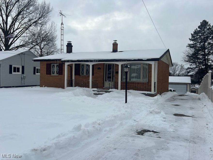 Great Brick and vinyl  Ranch w/ oversized Master bedroom, beautiful custom windows, enclosed sun room off of kitchen w/ deck leading to backyard and covered gazebo, finished basement w/ bar, fireplace, vinyl privacy fence ,2024 Hot water tank, all appliances stay, glass block basement windows, Heated driveway w/ detached 2+ car garage & storage shed,  
Won't last!  Call Patricia Dutton for all showings.  330-327-6517