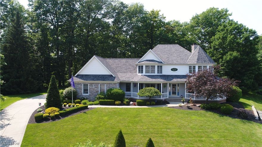 Welcome to this stunning custom built home located in the sought after Hartshire Woods development. At the end of the cul-de-sac you will instantly notice the breathtaking curb appeal of this stand out colonial perched up upon the hill, offering a private atmosphere yet minutes away from the interstate, dining, and shopping. Step inside to a welcoming entryway foyer, that opens into a spacious great room with soaring lofted ceilings, custom built in cabinetry, and a grand fireplace- the perfect setting for gatherings or relaxing evenings. The updated eat in kitchen features all newer appliances, ample cabinetry, granite countertops, instant hot water, and leads out to the attached four seasons room with serene views of the surrounding woods. A first floor flex room offers versatility as a home office, playroom, or could be converted to a fourth bedroom. The first floor master suite is a true retreat complete with a full bathroom, jetted tub, walk in shower, dual sinks and dual closets! Also conveniently located on the first floor is a half bathroom and large laundry room with newer washer and dryer. Upstairs you will find two spacious bedrooms each with walk in closets, a full bathroom extra storage space and a catwalk overlooking the foyer and great room below. The partially finished lower level includes a wet bar, gas fireplace, large open area for entertaining adjacent to tons of additional storage space. The heated three car garage is complete with electric and hot/cold water. Throughout the house you will be warmed by natural lighting and can utilize the surround sound system to your liking. Other recent updates include newer water softener, hot water tank (2022), new roof with gutter guards (2019) and high efficiency HVAC (2015). Pride of ownership truly shines from the interior all the way to the exterior. Call your favorite realtor today to schedule a tour of this one of a kind gem!